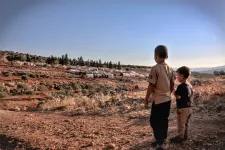 Two boys and a migrant camp (Photo: Ahmed Akacha/Pexels)