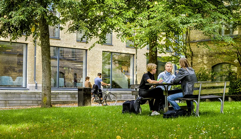 Students are studying outside the building Eden. 